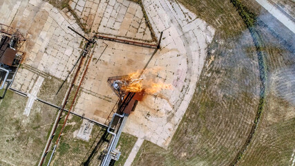 A burner for burning associated gas at a petrochemical plant.