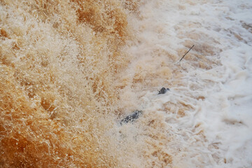 Water flows in river Cullenagh in Ennistymon town, county Clare, Ireland.