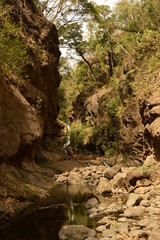 Surfing and cliff diving by the waterfalls in El Salvador, Central America