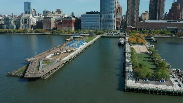 flying lower clockwise around Pier 26 in NYC