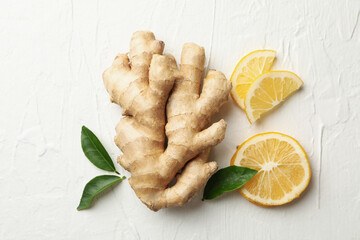 Fresh raw ginger and lemon on white background