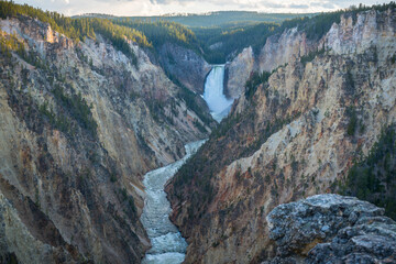 lower falls of the yellowstone national park from artist point at sunset, wyoming, usa