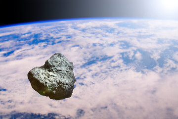 Asteroid on the background of the planet earth. 