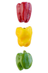 Red, yellow and green peppers against white background. Traffic light concept.