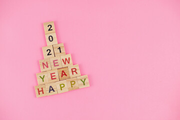 Happy New Year and Merry Christmas. Scrabble letters. Letter tiles spelling celebration holiday.
