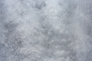 Textured putty on the wall. Rough background of a grunge wall. Space for text
