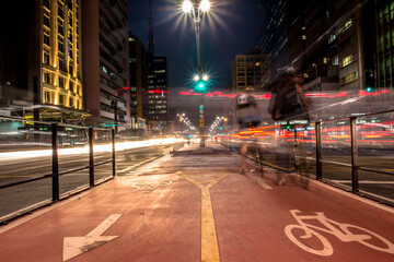 Fototapeta na wymiar Bicycle path in Paulista Avenue at night. This is one of the most important thoroughfares of the city of Sao Paulo, one of the main financial centers of the city