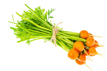 Bunch of fresh round carrots, organic vegetables, vegetarian food.