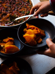 Roast pumpkin Italian ragout in bowl and roasting dish. Low carb. Home made. Natural light