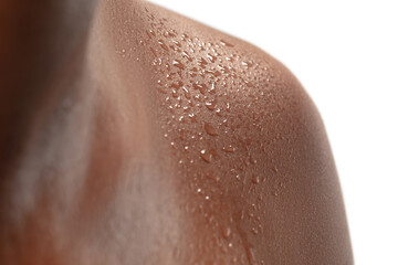 Fototapeta premium Close up of female neck and shoulder with water drops in beautiful shine. African-american model. Beauty, fashion, skincare, cosmetics concept. Copyspace for ad. Well-kept skin, fresh look.