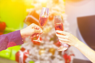 Two glasses of champagne with lights in the background. christmas background