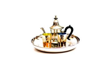 Group of teapot and glasses of oriental tea on a tray on white background
