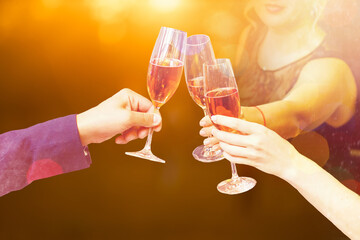 Two glasses of champagne with lights in the background. christmas background