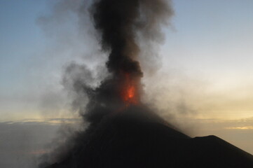 Fototapeta premium The volcano Fuego erupting with exploding lava, magma and ashes in Guatemala