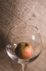 apple in a glass, promoting a healthy lifestyle, choose fruit instead of alcohol