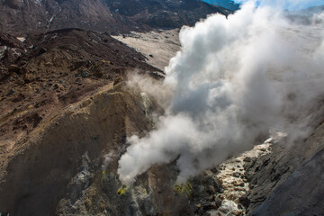 View of a volcanic slope with thermal steam exits to the surface