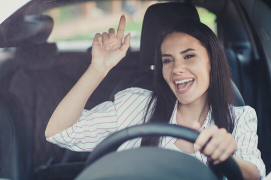 Close-up portrait of her she nice attractive brunette pretty lovely cute cheerful cheery businesslady riding car motorway highway having fun listening radio singing pop hit
