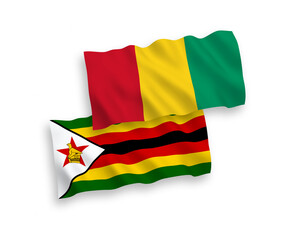 Flags of Guinea and Zimbabwe on a white background