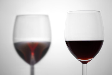 close up on a red wineglass on white background with copy space for your text