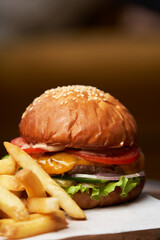 Cheeseburger with french fries and sauces