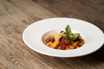 Pasta Penne with Tomato, olives and Basil