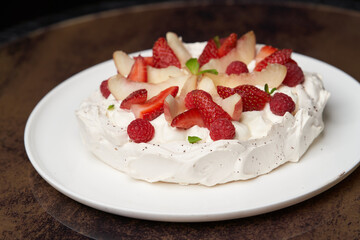 Strawberry cake with fresh strawberries on white plate
