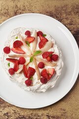 Strawberry cake with fresh strawberries on white plate