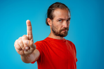 Bearded man gesturing 'stop' or 'wait a minute"