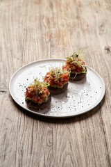 Salmon tartare with guacamole sauce, close-up