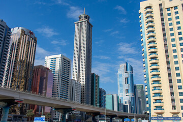Fototapeta na wymiar Emirates Road in Dubai, United Arab Emirates on a blue sky sunny day.