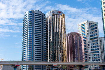 Fototapeta premium Emirates Road in Dubai, United Arab Emirates on a blue sky sunny day.