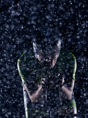 triathlon athlete riding bike on rainy night