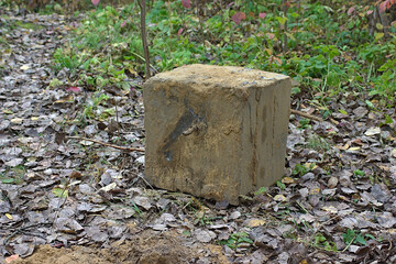 concrete cube with rebar, dug out of the ground