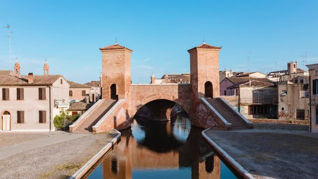 View of the symbol of Comacchio at morning with blue sky, the Trepponti bridge. Timelapse 4K