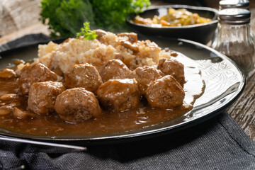Minced meat balls in mushroom sauce.