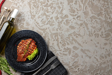Grilled beef steak served on plate close up