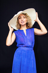 Woman in hat delights in surprise happiness close-up