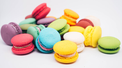 Fototapeta na wymiar pastel colored macarons isolated on white background.