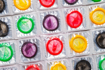 Colorful condoms background.
