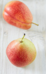 beautiful ripe pears on wooden surface