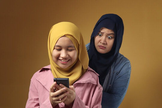 Asian muslim mother shocked and worried to see her daughters phone, bad content for kid