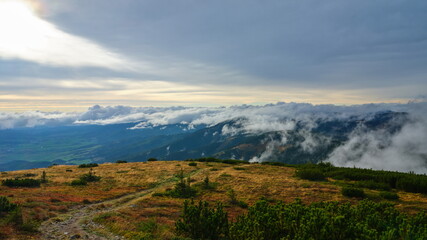 Obraz na płótnie Canvas Small clouds rolling over a mountain ridge, Low Tatras, Slovakia.