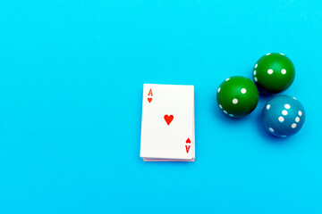 Ace of hearts and three dice on blue pastel background. Top view