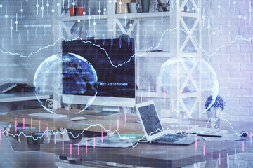 Financial chart drawing and table with computer on background. Double exposure. Concept of international markets.