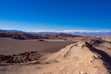 Fototapeta na wymiar Path on the amazing Valle de la Luna, a natural paradise. Atacama Desert, Chile.