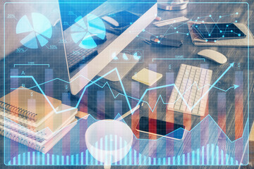 Double exposure of forex graph and work space with computer. Concept of international online trading.