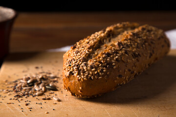 multigrain wholemeal bread with seeds on brown wooden table