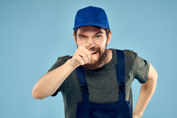 man in work uniform uniform professional work lifestyle delivery service blue background