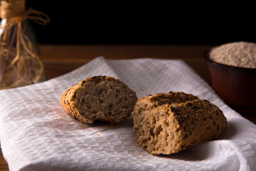 multigrain wholemeal bread with seeds on brown wooden table