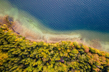 Autum Fall Top view from Drone of Lake Tegernsee and colorful Forest with trees. Lake Shore in...